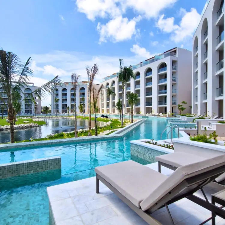 Swim-up suite terrace with sun loungers at Excellence Coral Playa Mujeres, Cancun
