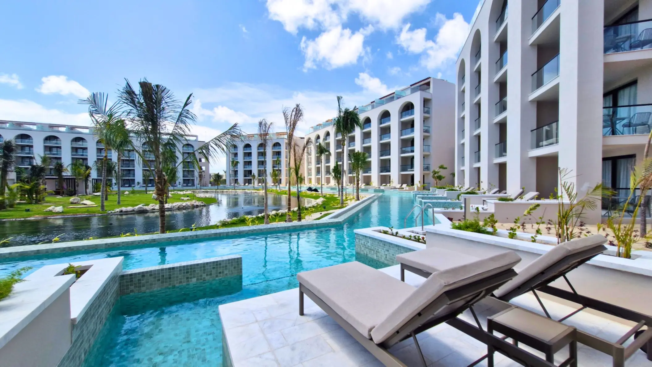 Swim-up suite terrace with sun loungers at Excellence Coral Playa Mujeres, Cancun