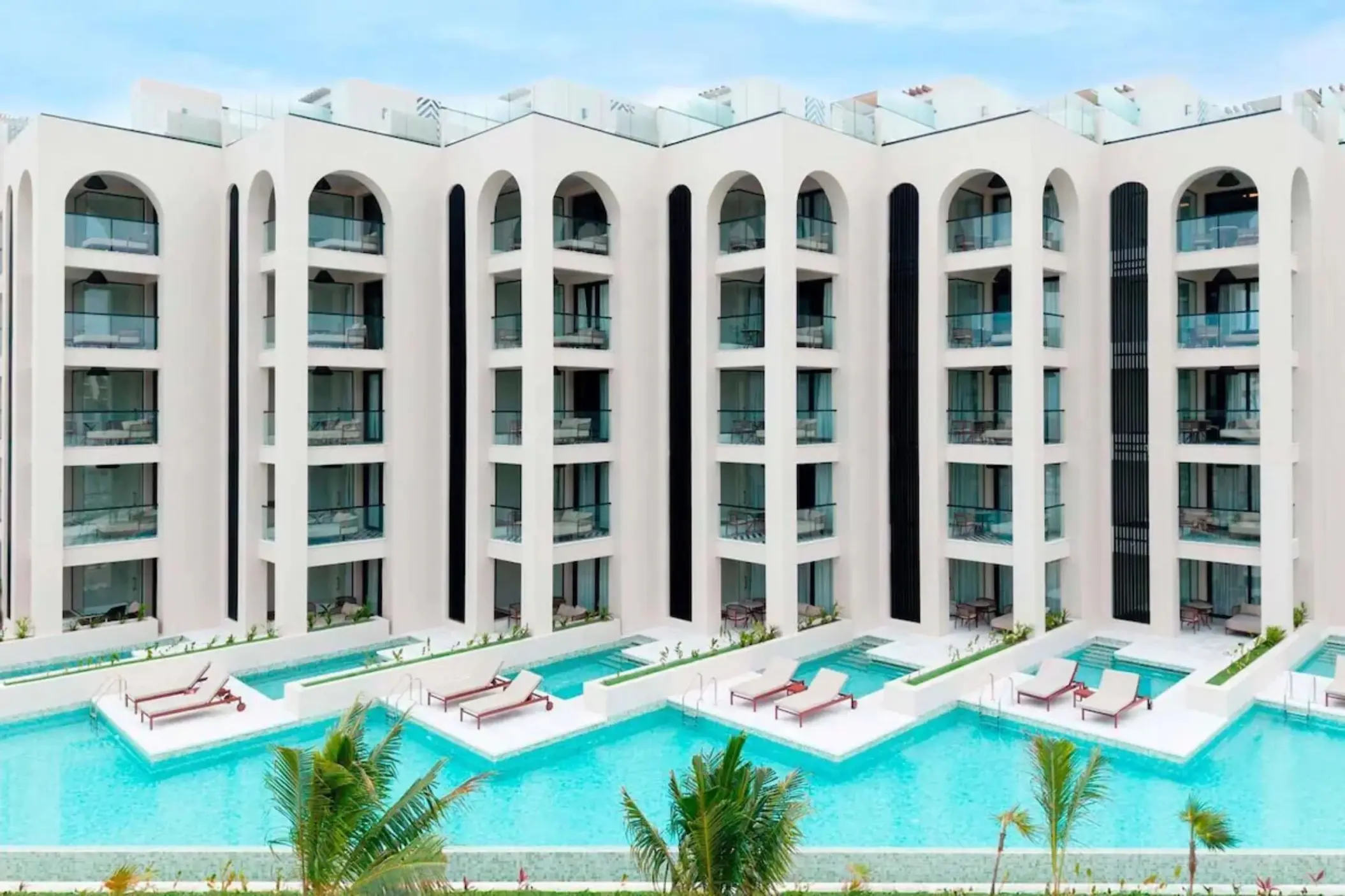 Swim-up suites and multi-story guest room building at Excellence Coral Playa Mujeres, Cancun