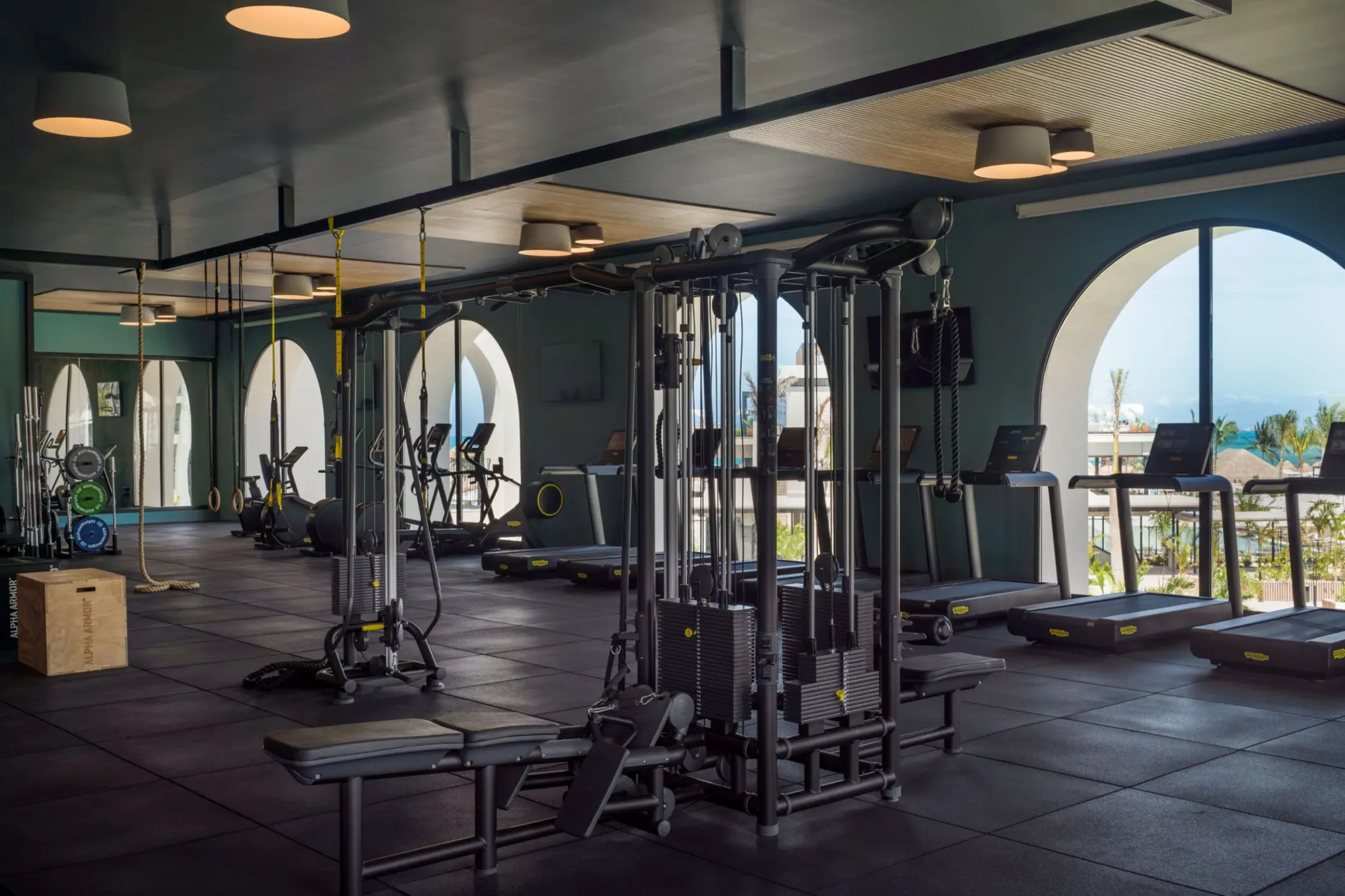 Fitness center with weight machines and treadmills at Excellence Coral Playa Mujeres, Cancun