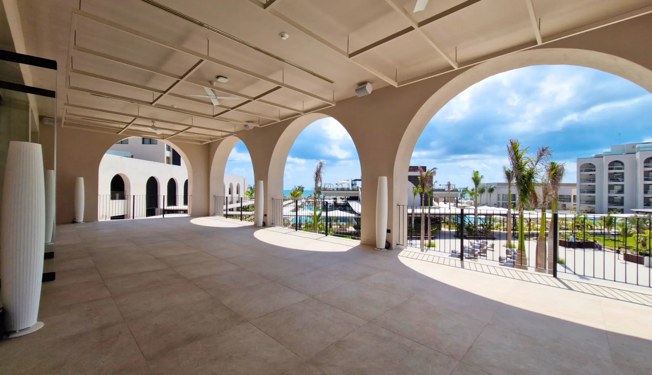 Ballroom terrace with stone arches and resort views at Excellence Coral Playa Mujeres, Cancun