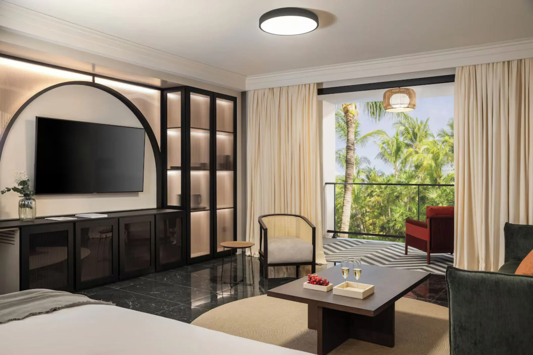 Modern suite with a balcony overlooking tropical gardens at Excellence Coral Playa Mujeres, Cancun