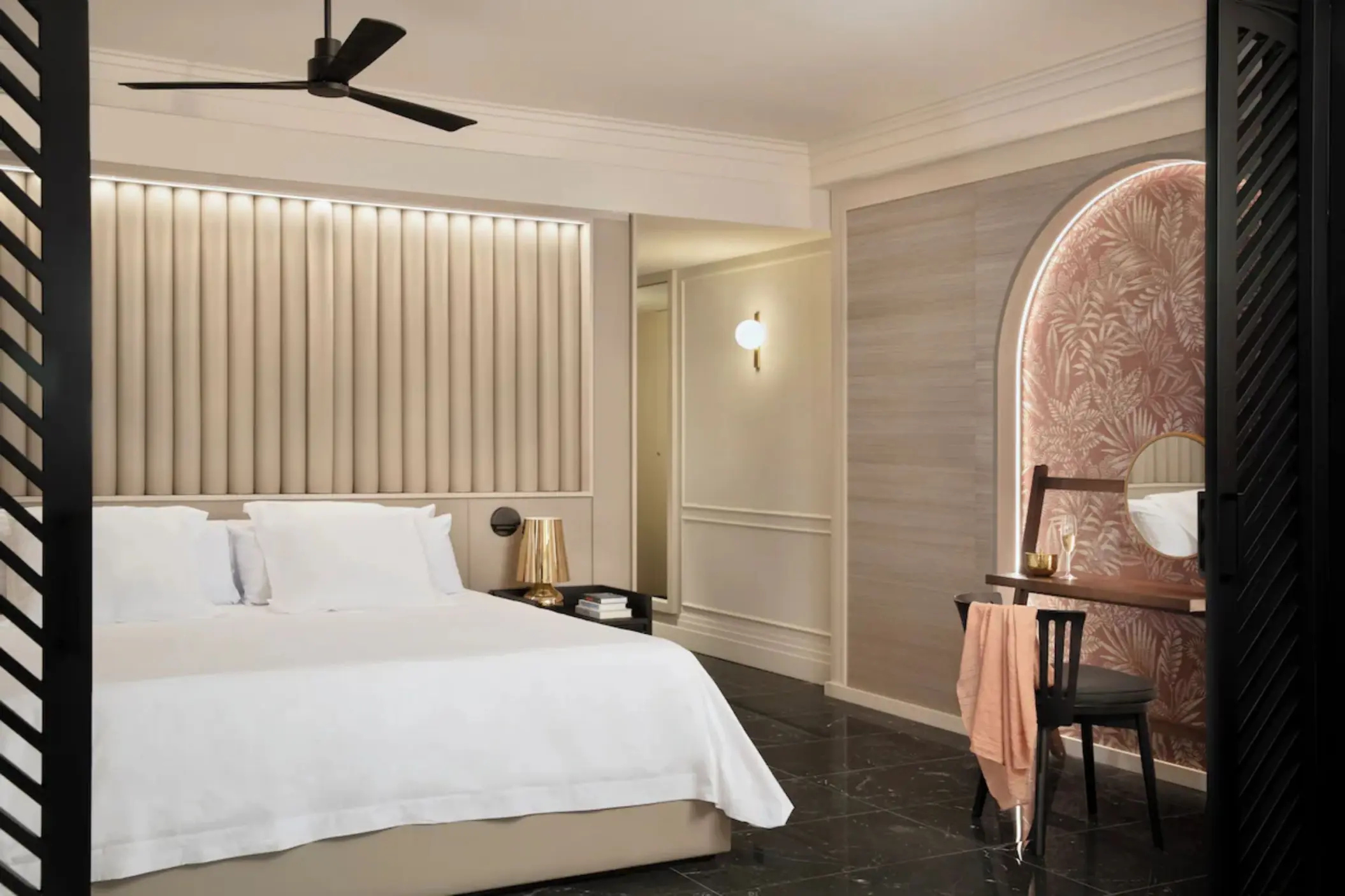 Suite with king bed and vanity desk at Excellence Coral Playa Mujeres, Cancun