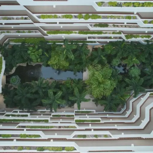 Overhead view of the lush garden atrium and palm trees at Fiesta Americana Condesa, Cancun