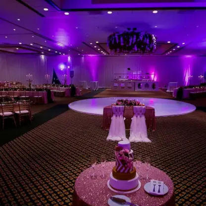 Ballroom wedding reception with purple lighting and a circular dance floor at Fiesta Americana Condesa, Cancun