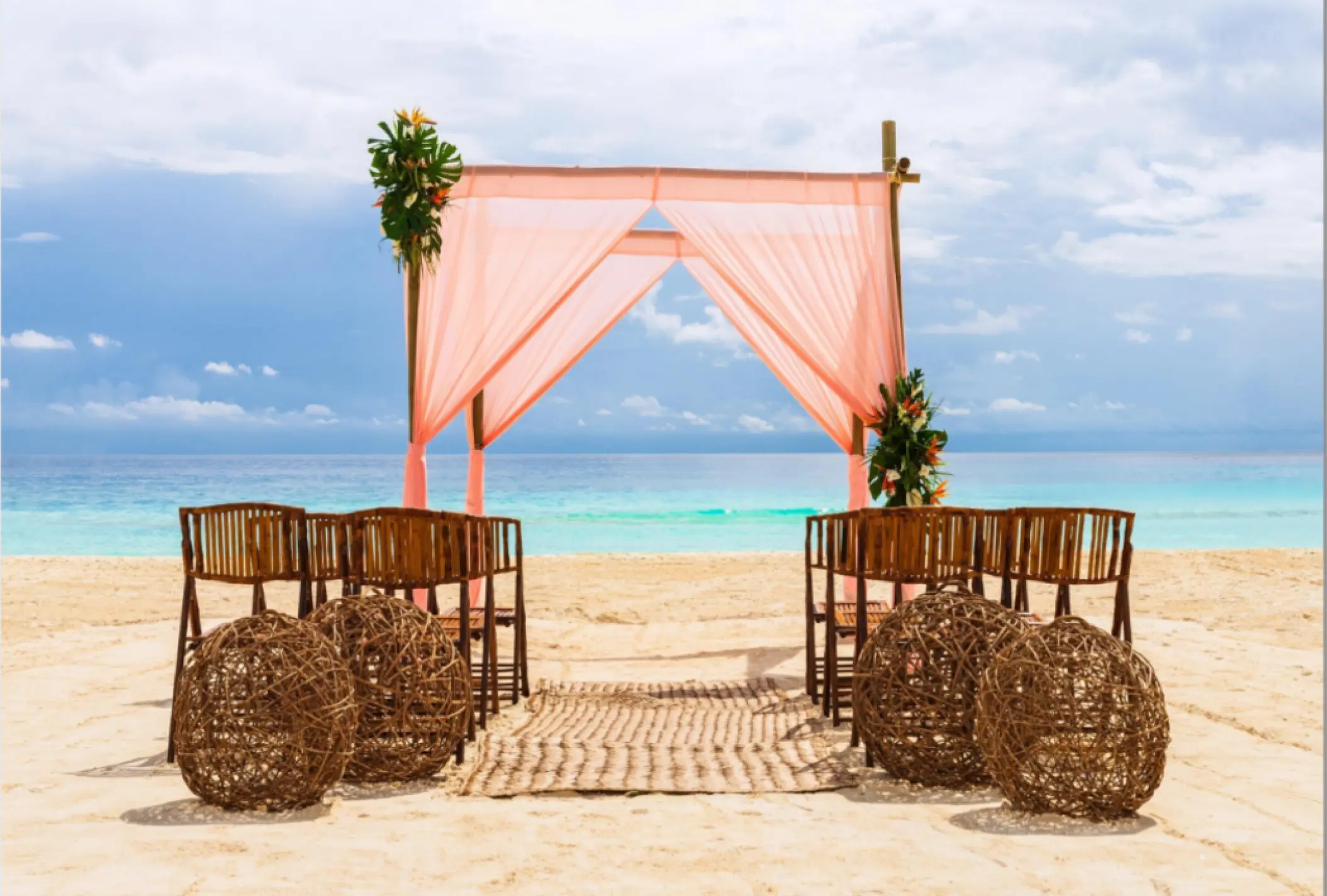 Beach wedding ceremony with pink draped huppah at Fiesta Americana Condesa, Cancun