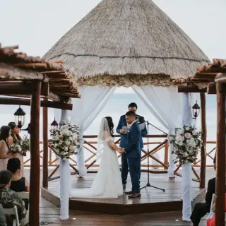 Wedding ceremony under a thatched gazebo at Fiesta Americana Condesa, Cancun