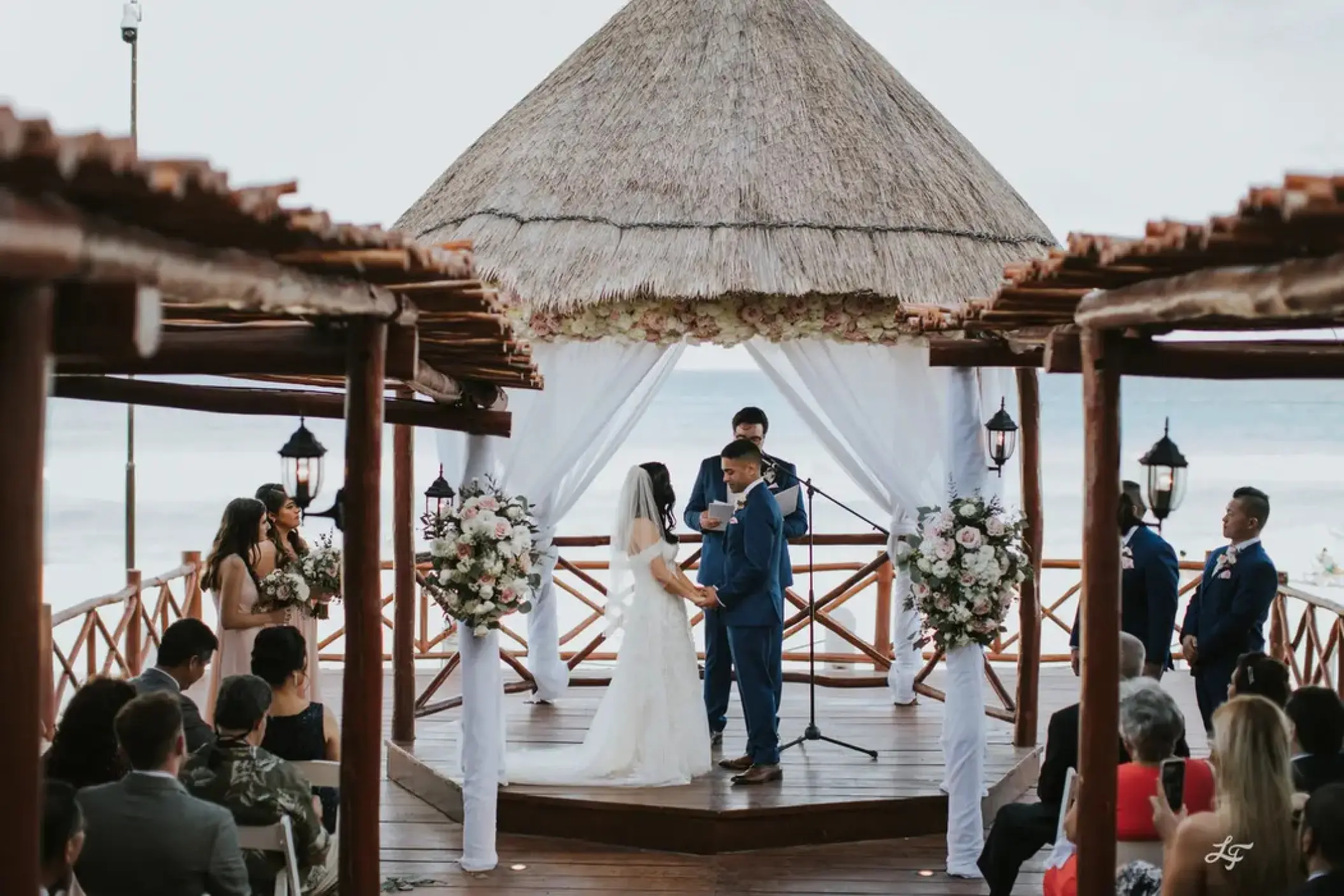 Wedding ceremony under a thatched gazebo at Fiesta Americana Condesa, Cancun