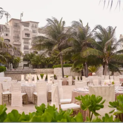 Outdoor wedding reception setup with light-up LOVE sign at Fiesta Americana Condesa, Cancun