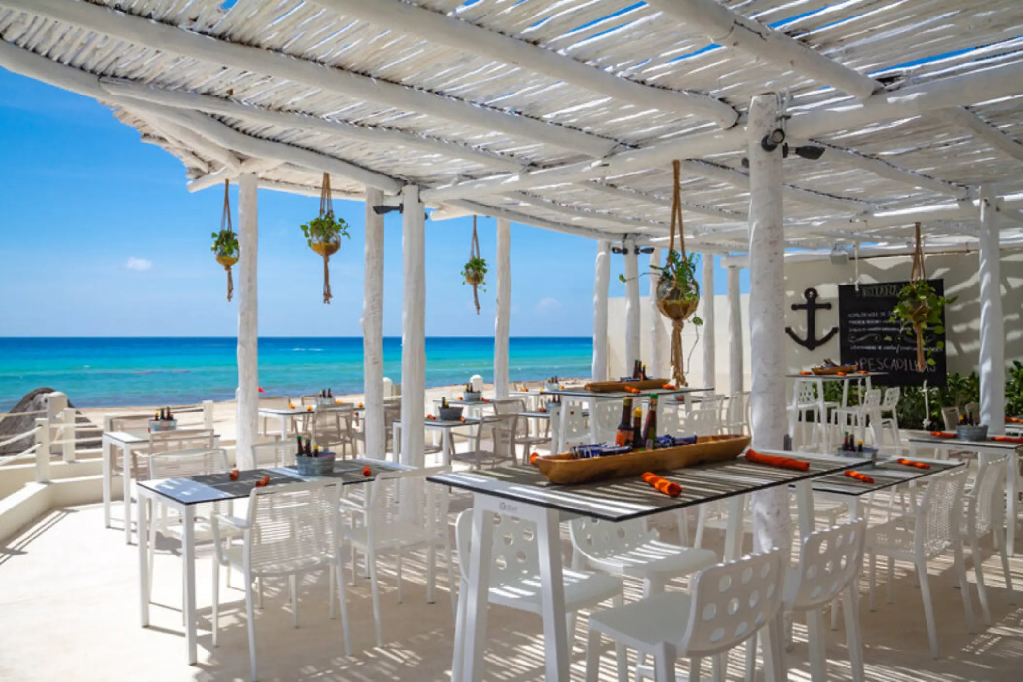 La Cevicheria beachfront restaurant with white wood pergola and ocean views at Fiesta Americana Condesa, Cancun