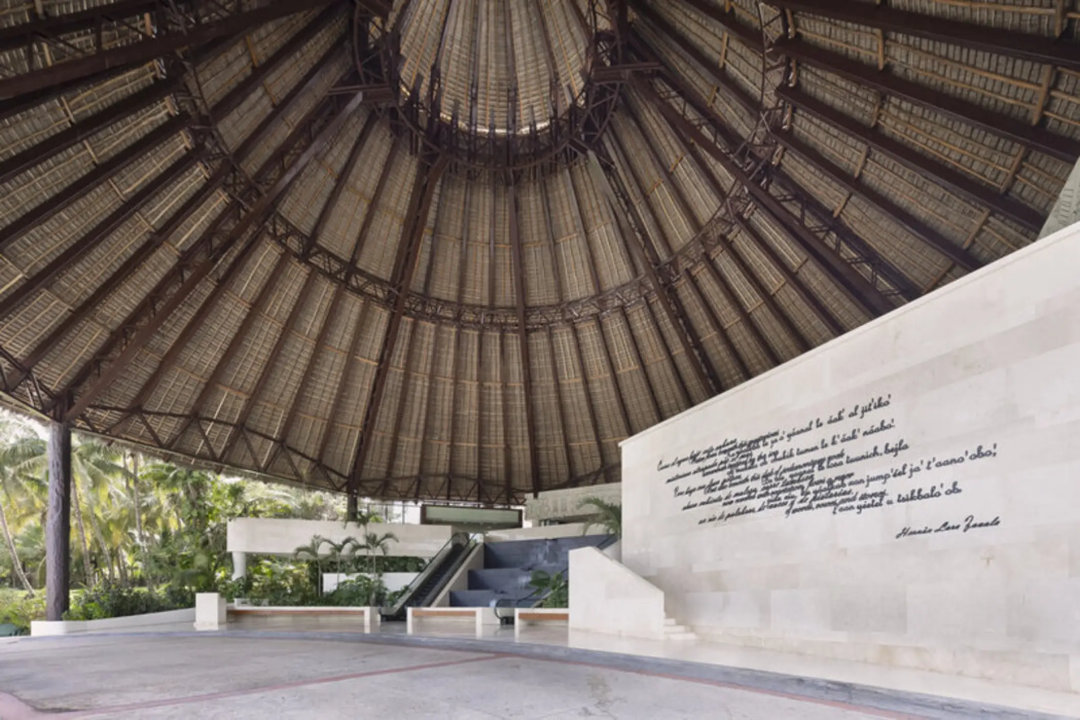 Fiesta Americana Condesa large thatched palapa lobby with script mural, Cancun
