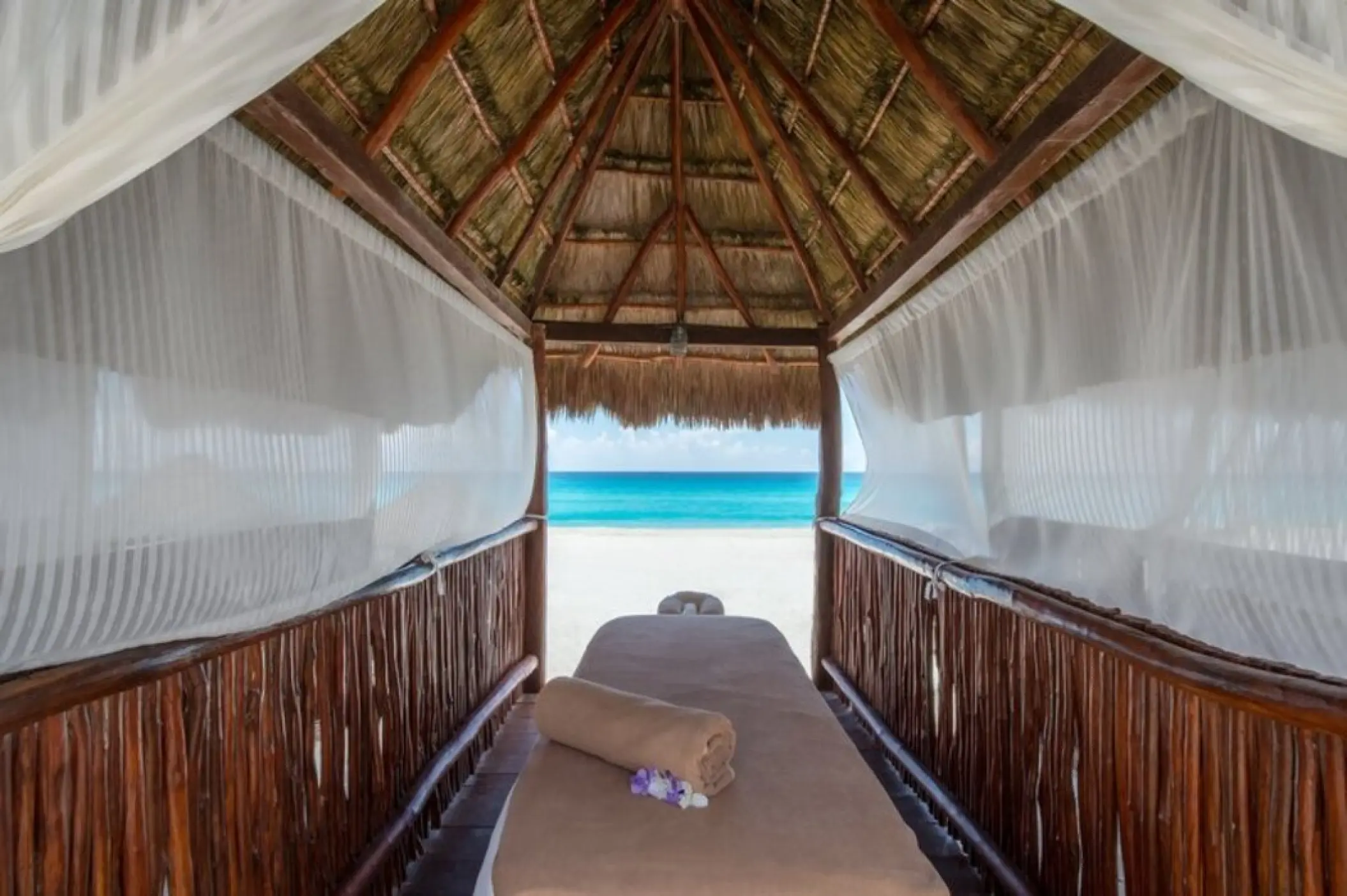 Beachfront massage setup at Fiesta Americana Condesa, Cancun