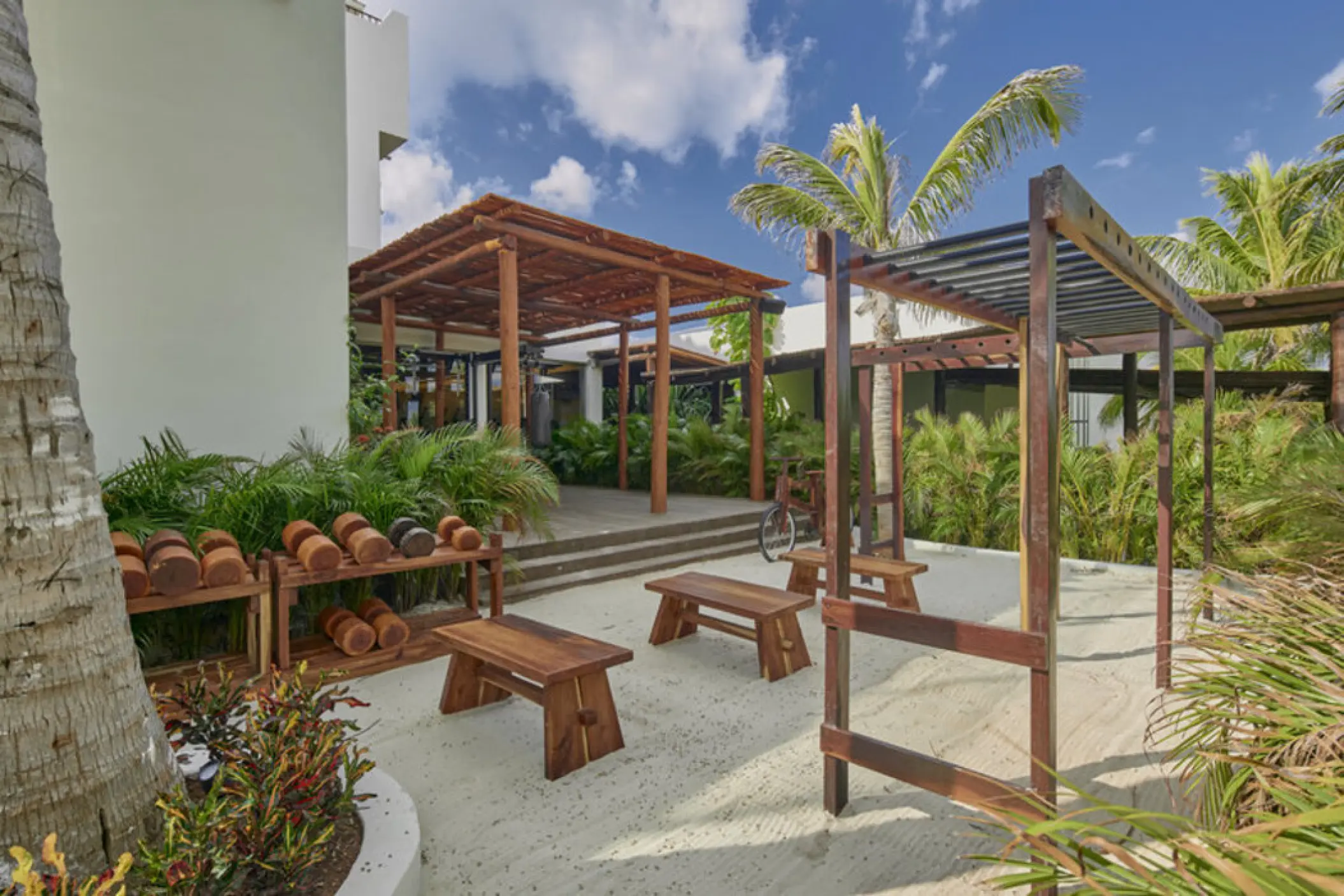Outdoor gym with wooden weights and benches at Fiesta Americana Condesa, Cancun