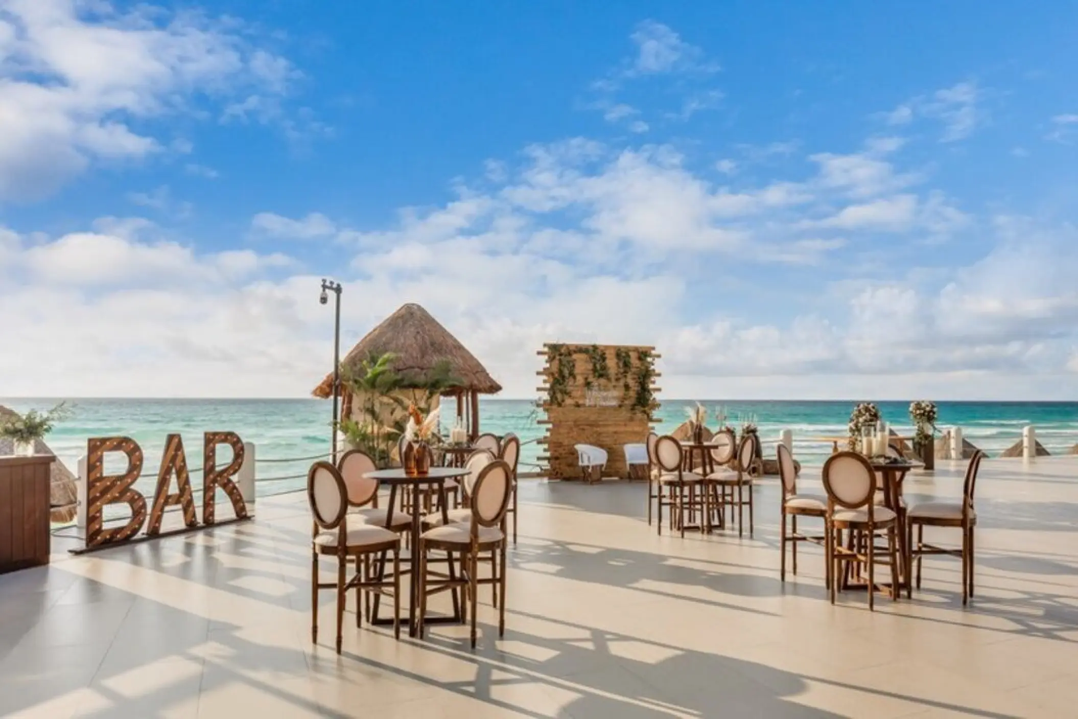 Terraza Luna wedding reception setup with wooden bar and ocean views at Fiesta Americana Condesa, Cancun