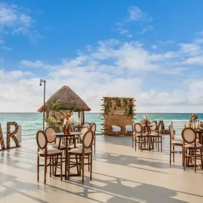 Terraza Luna wedding reception setup with wooden bar and ocean views at Fiesta Americana Condesa, Cancun