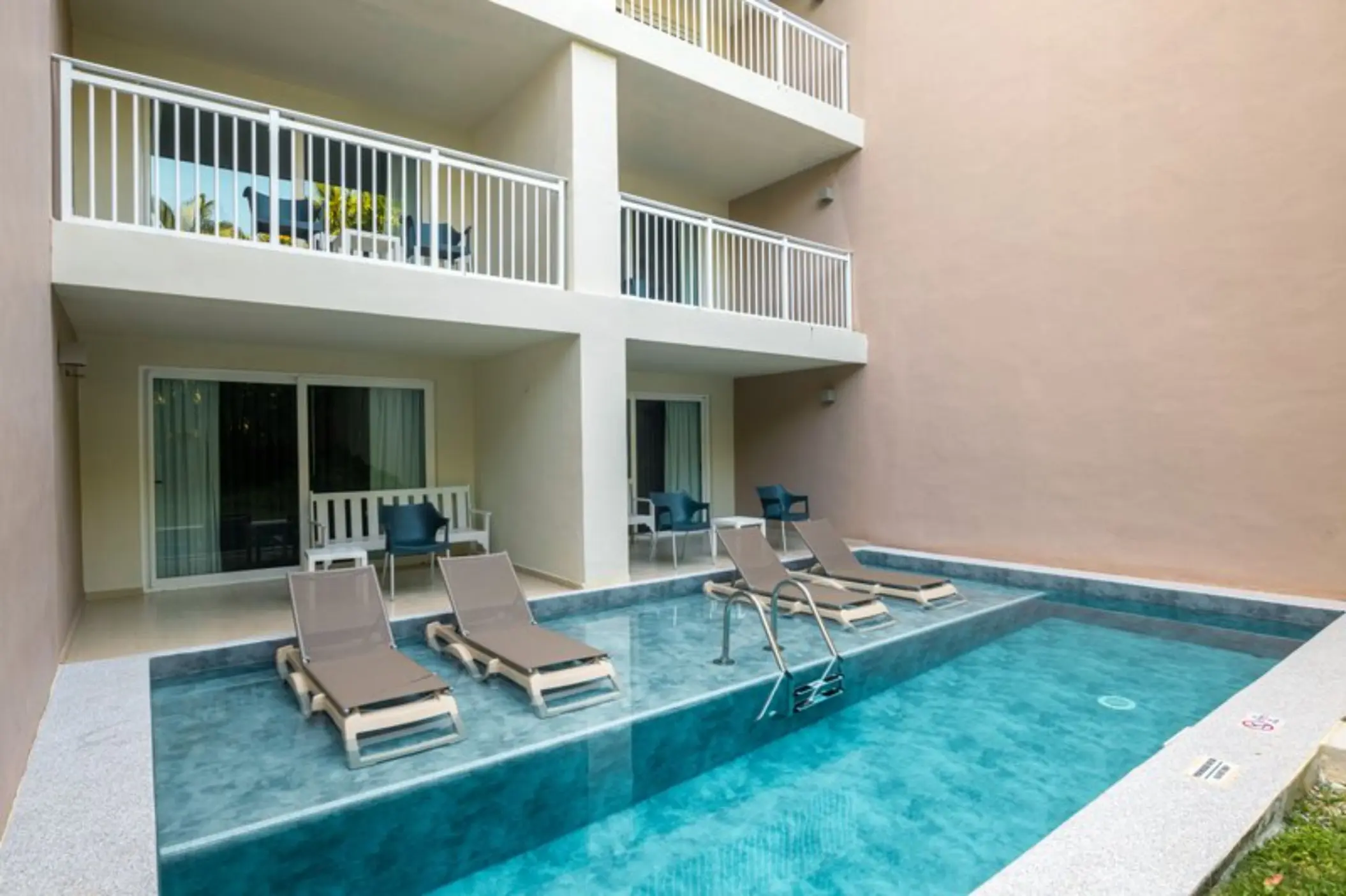 Suite with private plunge pool and in-water lounge chairs at Fiesta Americana Cozumel