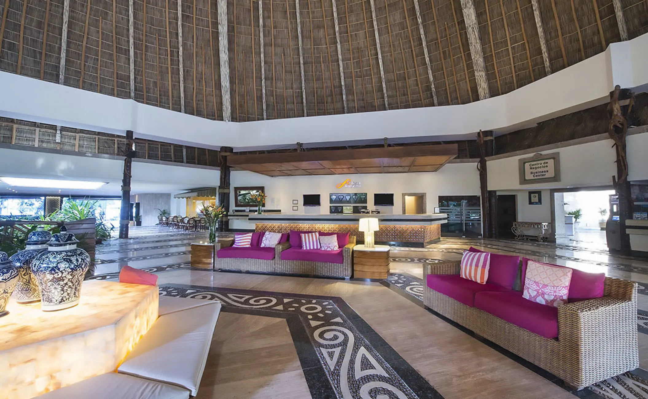 Fiesta Americana Puerto Vallarta lobby with pink sofas under a large palapa roof, Puerto Vallarta