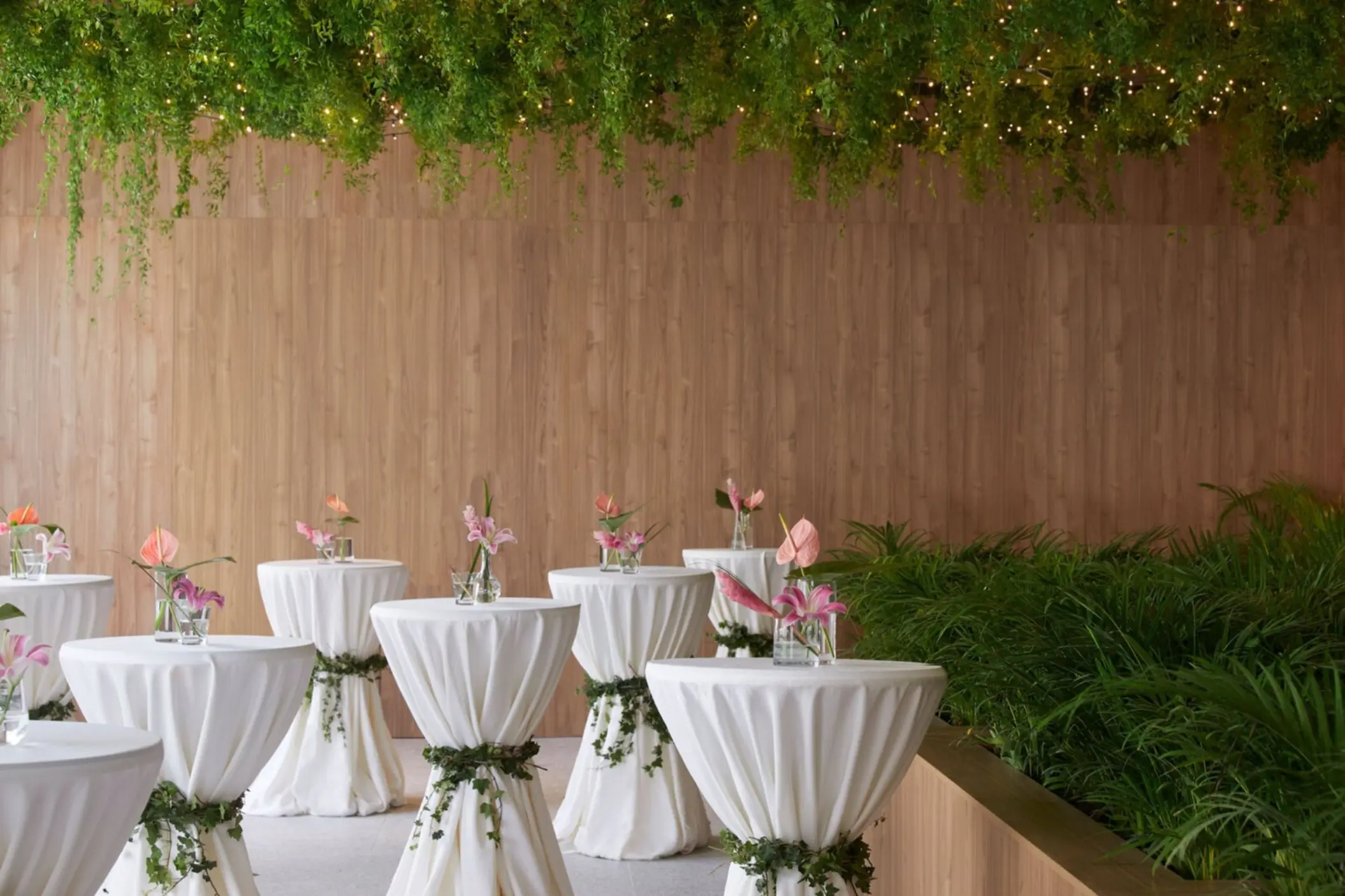 Cocktail tables with white linens and greenery at Finest Punta Cana, Punta Cana