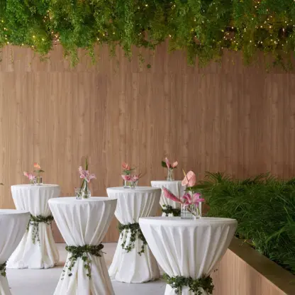 Cocktail tables with white linens and greenery at Finest Punta Cana, Punta Cana