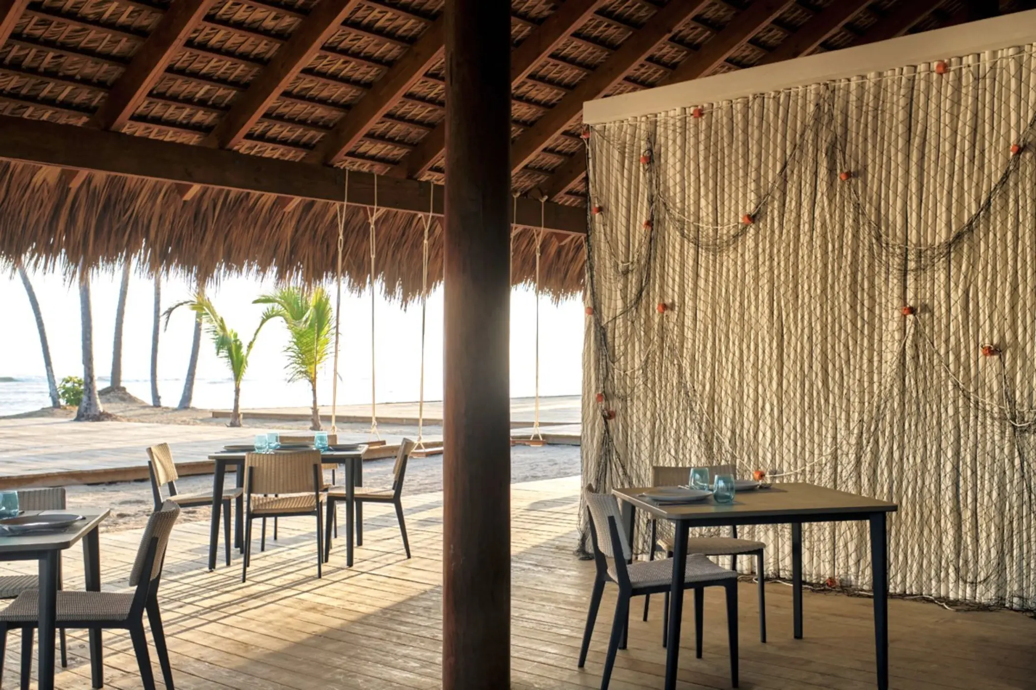 Las Dunas Beachhouse restaurant with thatched roof and ocean views at Finest Punta Cana, Punta Cana