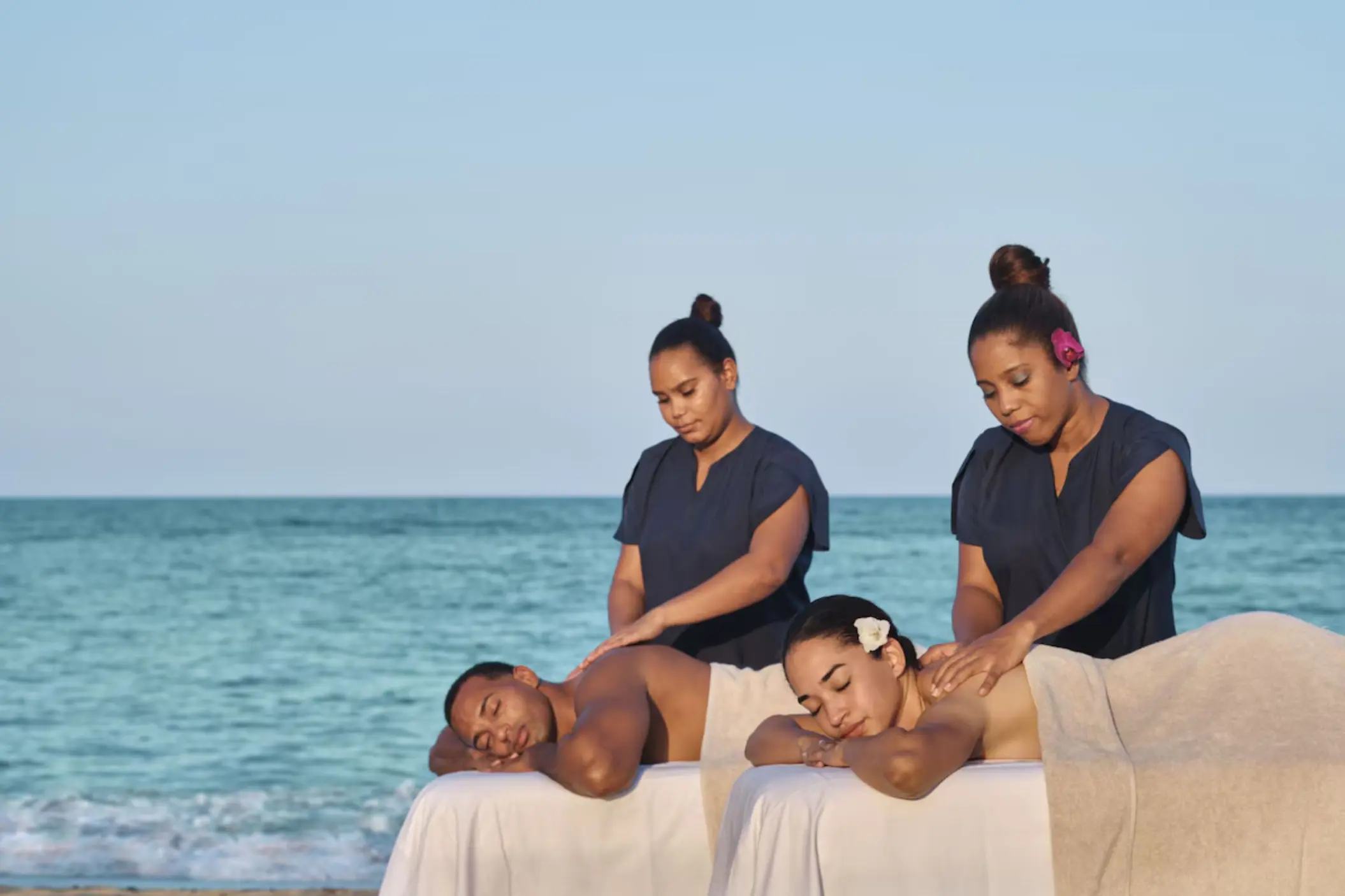 Outdoor couples massage on the beach at Finest Punta Cana, Punta Cana