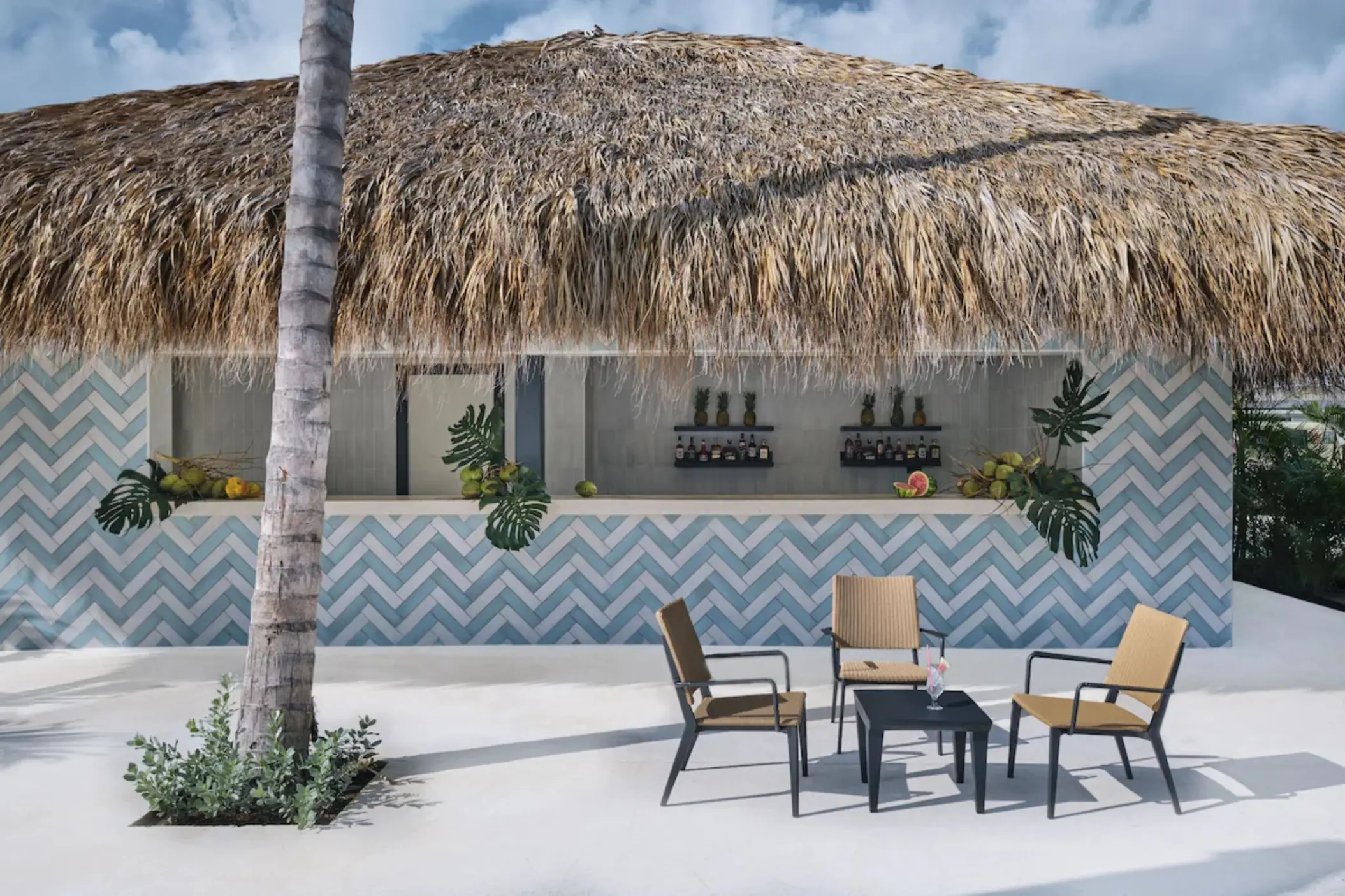 Thatched roof poolside bar with blue and white chevron tile at Finest Punta Cana, Punta Cana