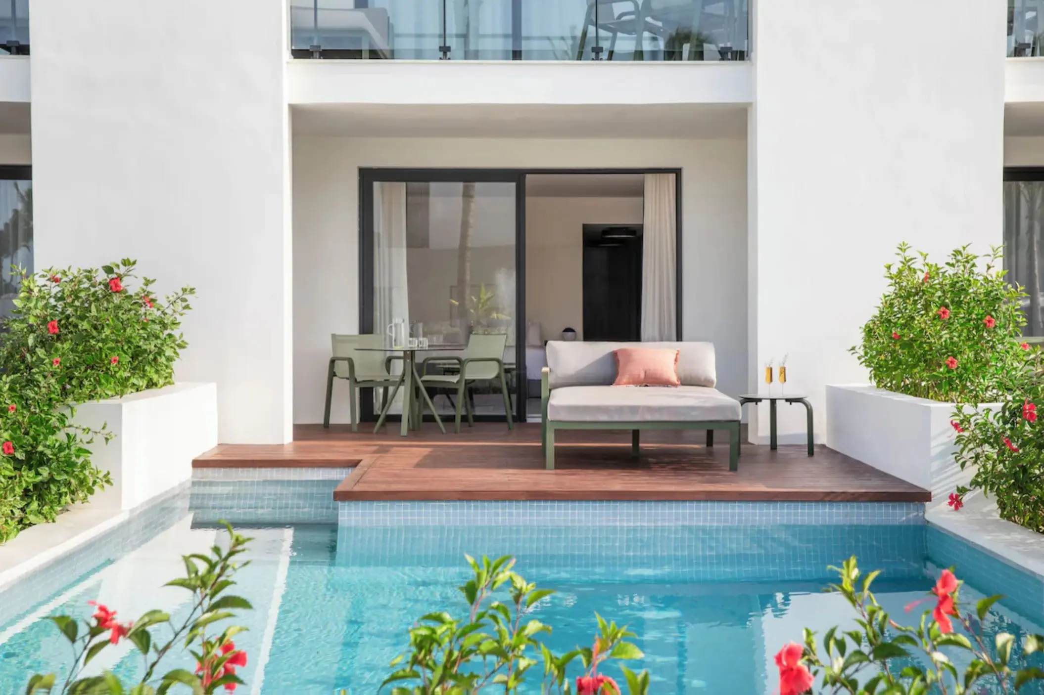 Swim-up suite terrace with wooden deck and private pool at Finest Punta Cana, Punta Cana