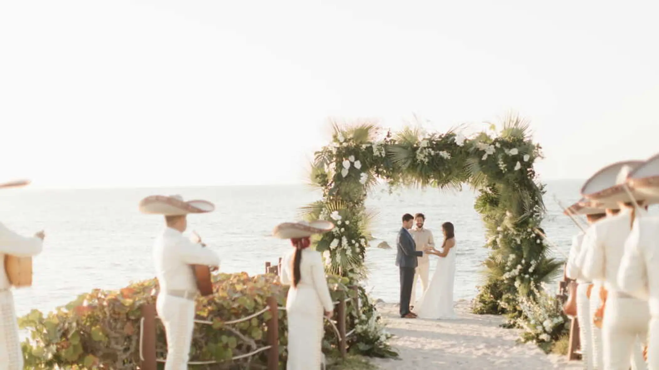 Beachfront wedding ceremony with a mariachi band at Four Seasons Punta Mita