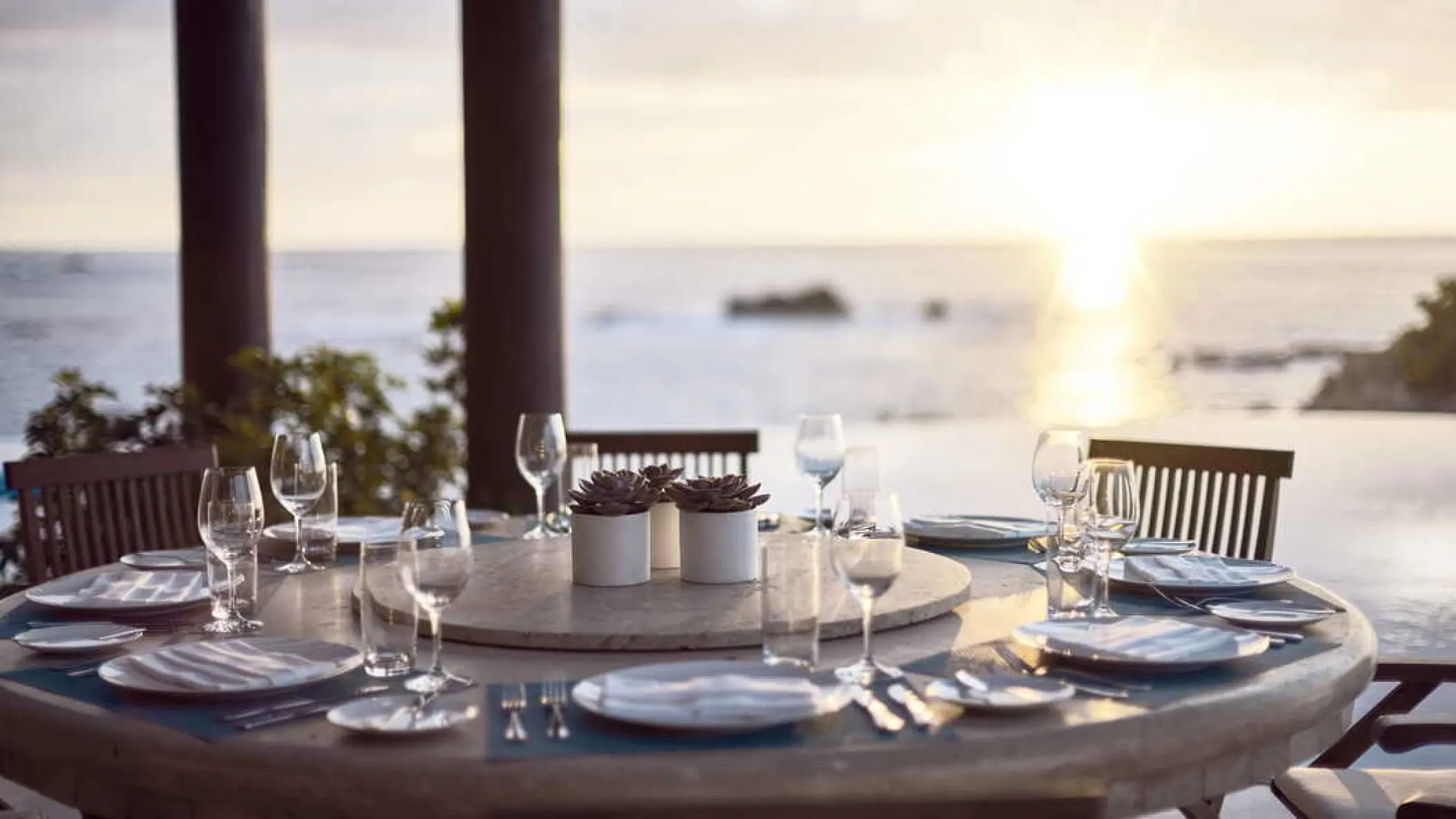 Oceanfront wedding reception table at Four Seasons Punta Mita at sunset