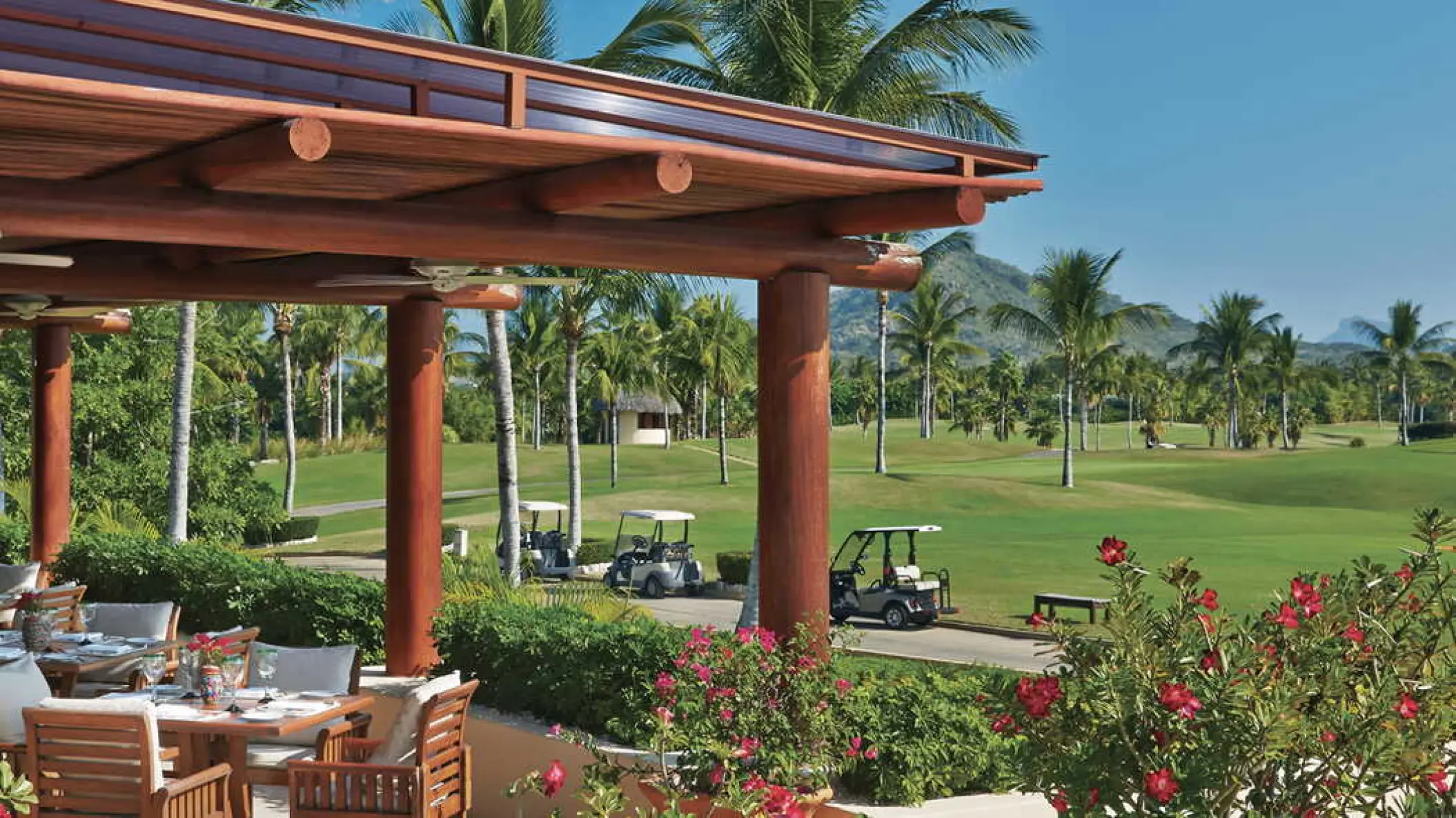 Outdoor restaurant patio overlooking the golf course at Four Seasons Resort Punta Mita