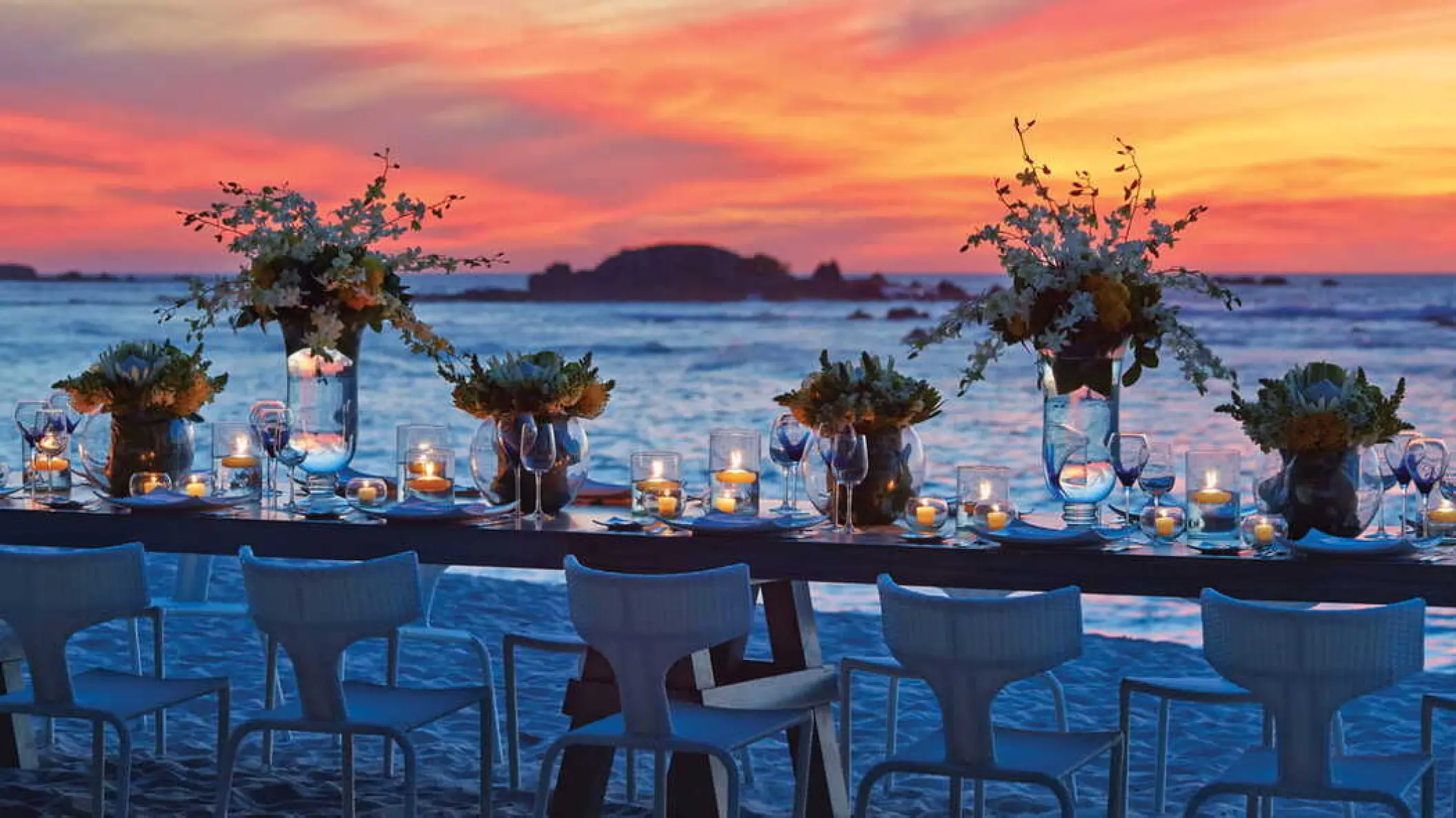 Beachfront wedding reception setup at sunset, Four Seasons Punta Mita