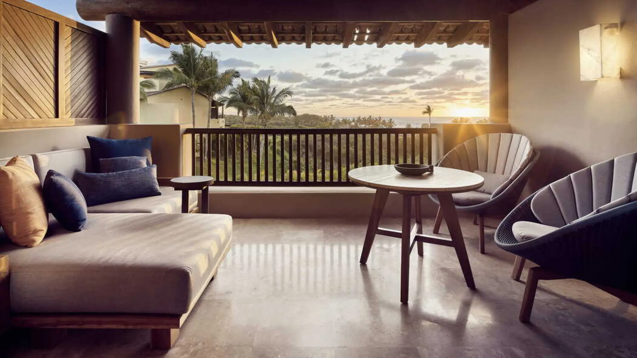 Four Seasons Punta Mita suite balcony with lounge seating at sunset, Punta Mita