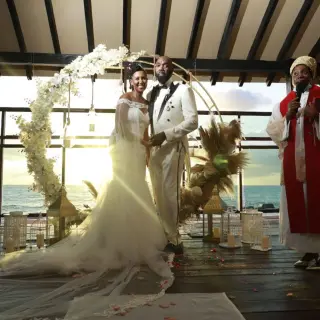 Bride and groom at a pier deck wedding ceremony at Generations Riviera Maya, Riviera Maya