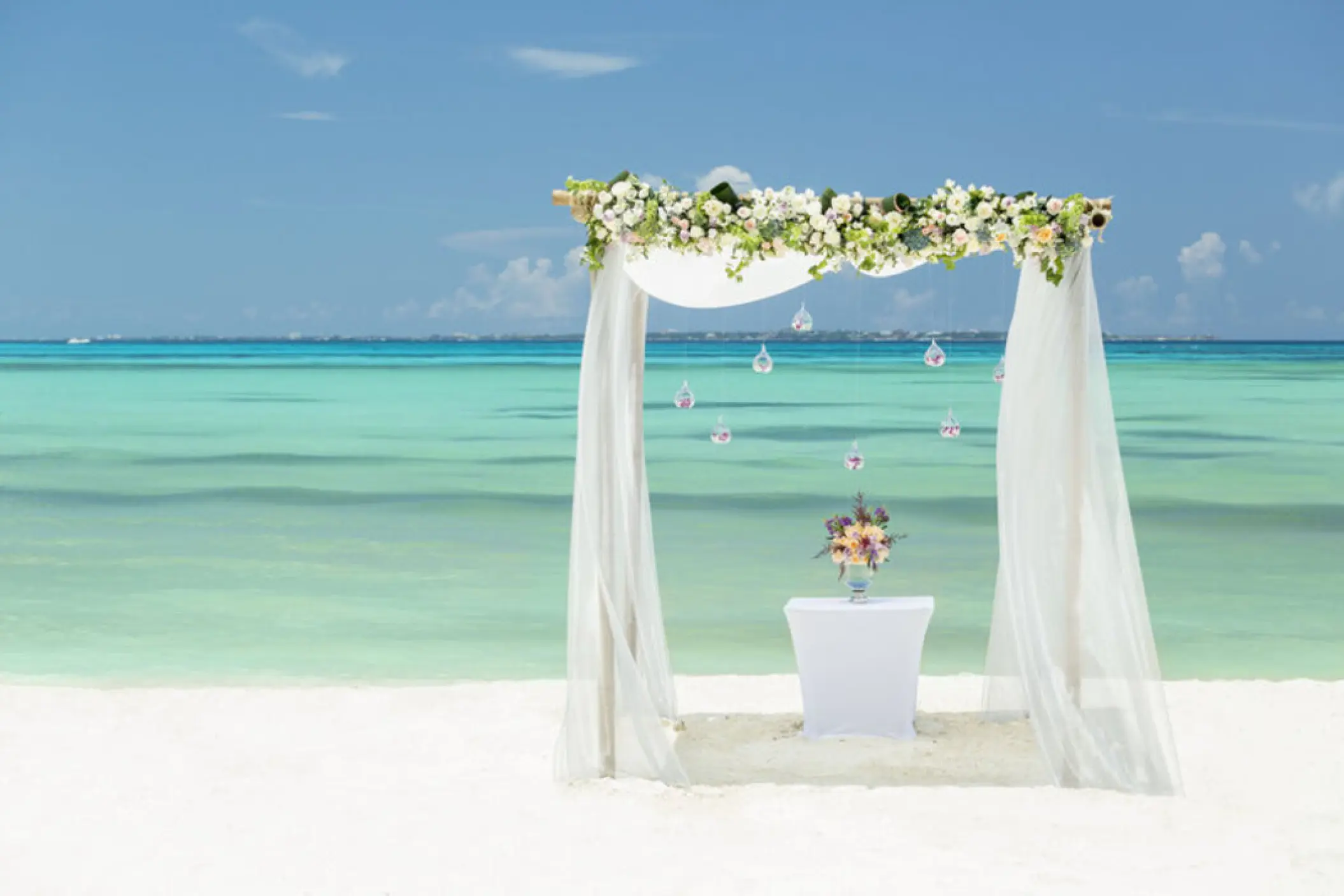 Beachfront wedding ceremony arch at Grand Fiesta Americana Coral Beach, Cancun