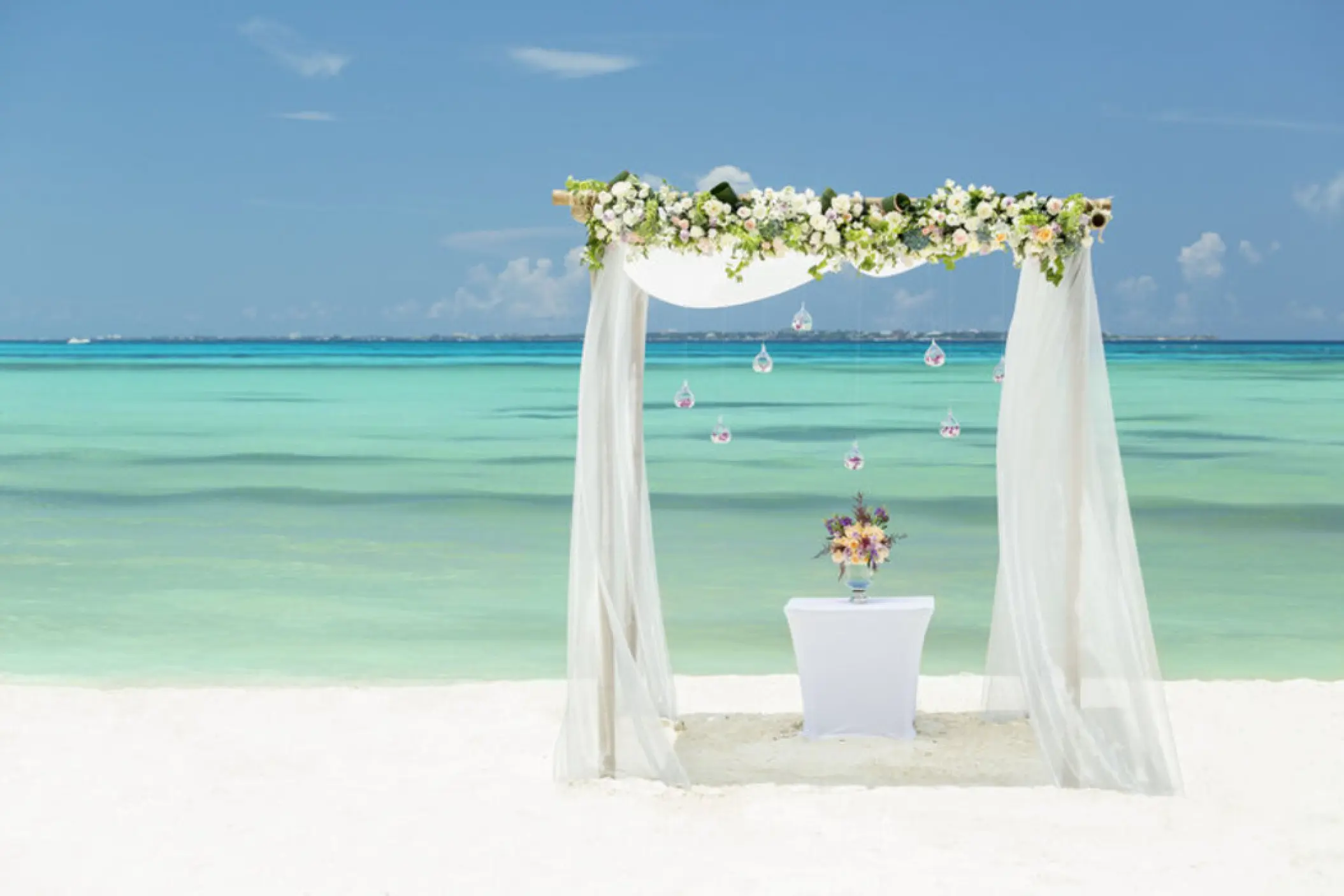 Beachfront wedding ceremony arch at Grand Fiesta Americana Coral Beach, Cancun