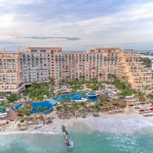 Aerial view of Grand Fiesta Americana Coral Beach resort pools and beachfront, Cancun