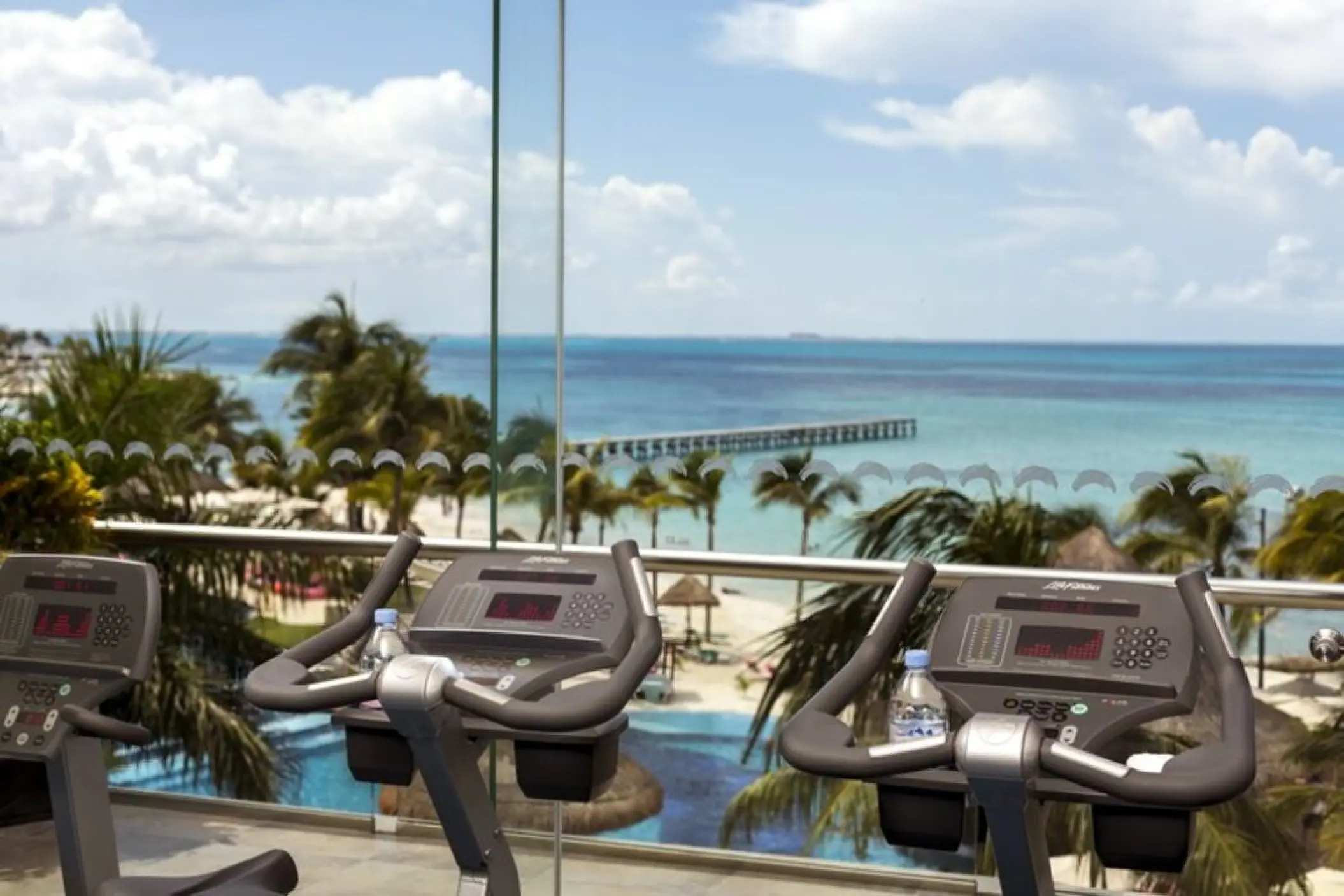 Stationary bikes in the gym overlooking the ocean at Grand Fiesta Americana Coral Beach, Cancun