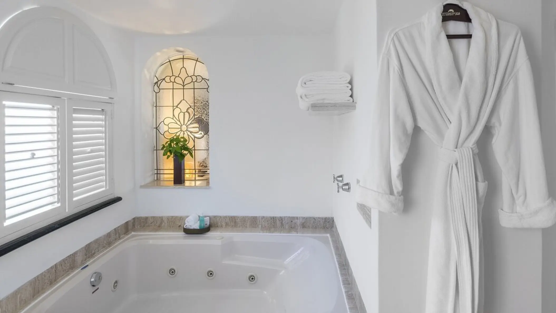 In-suite jacuzzi and white bathrobes at Grand Fiesta Americana Coral Beach, Cancun