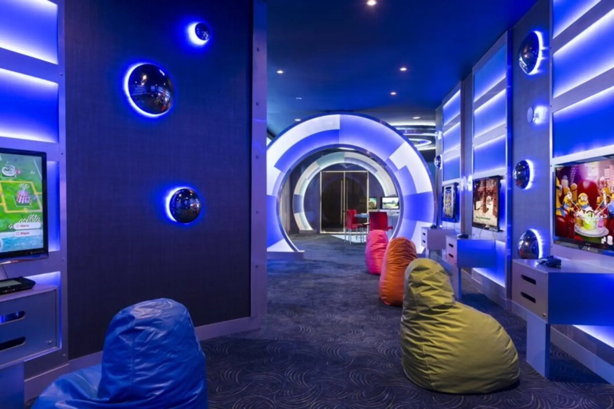 Futuristic kids club with gaming screens and bean bags at Grand Fiesta Americana Coral Beach, Cancun