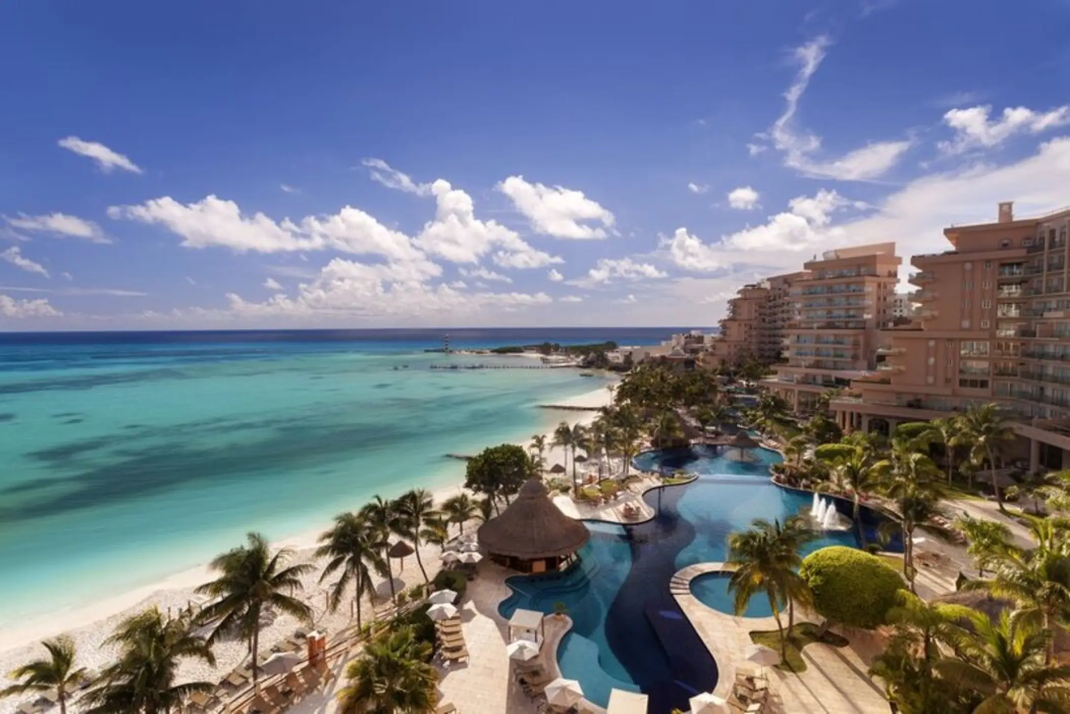 Grand Fiesta Americana Coral Beach beachfront, swimming pools, and resort buildings, Cancun