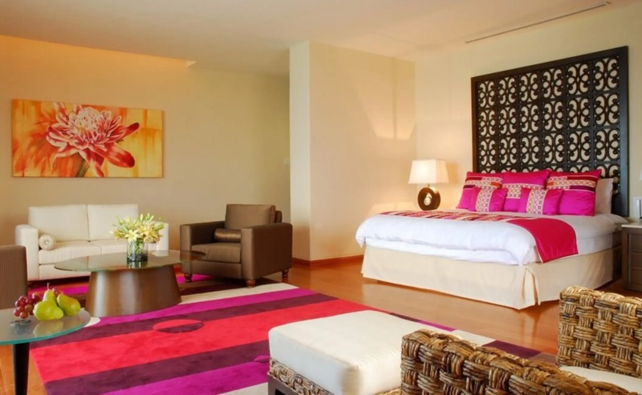 Presidential Suite with pink decor and seating area at Grand Fiesta Americana Coral Beach, Cancun