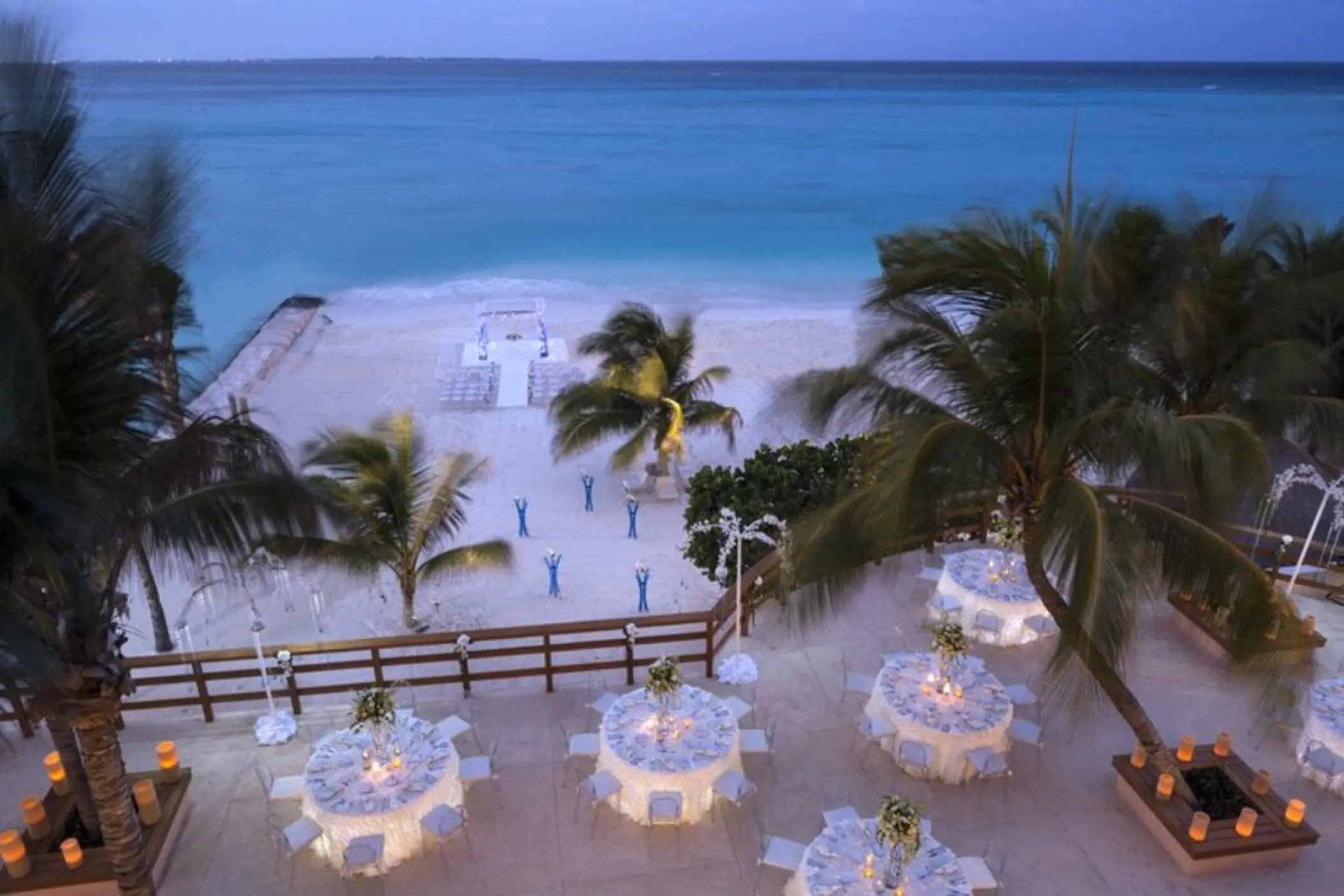 Terrace wedding reception and beach ceremony setup at Grand Fiesta Americana Coral Beach, Cancun