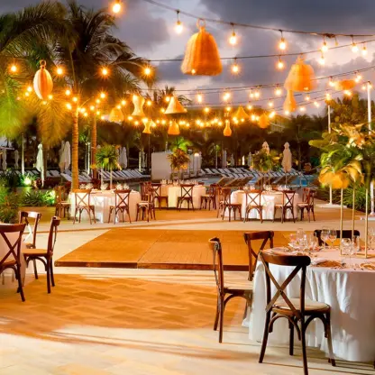 Outdoor wedding reception with string lights and dance floor at Grand Palladium Costa Mujeres, Cancun