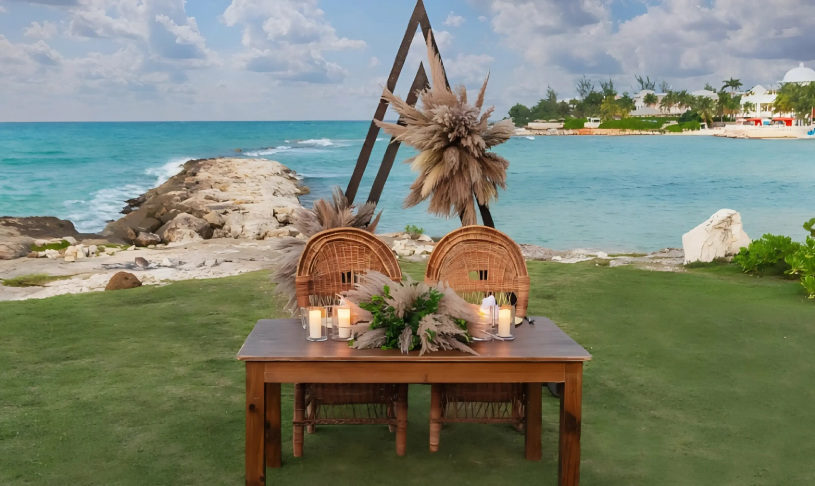 Bungalow lawn wedding reception table with pampas grass at Grand Palladium Jamaica, Ocho Rios