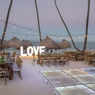 Beachfront wedding reception setup with LOVE marquee letters at Grand Palladium Punta Cana, Punta Cana