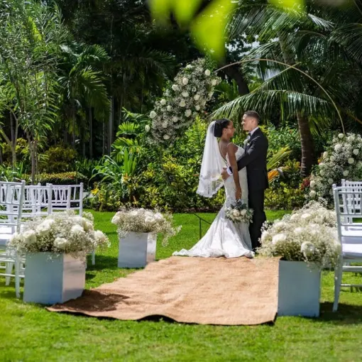 Bride and groom embrace at a garden wedding ceremony at Grand Palladium Punta Cana, Punta Cana