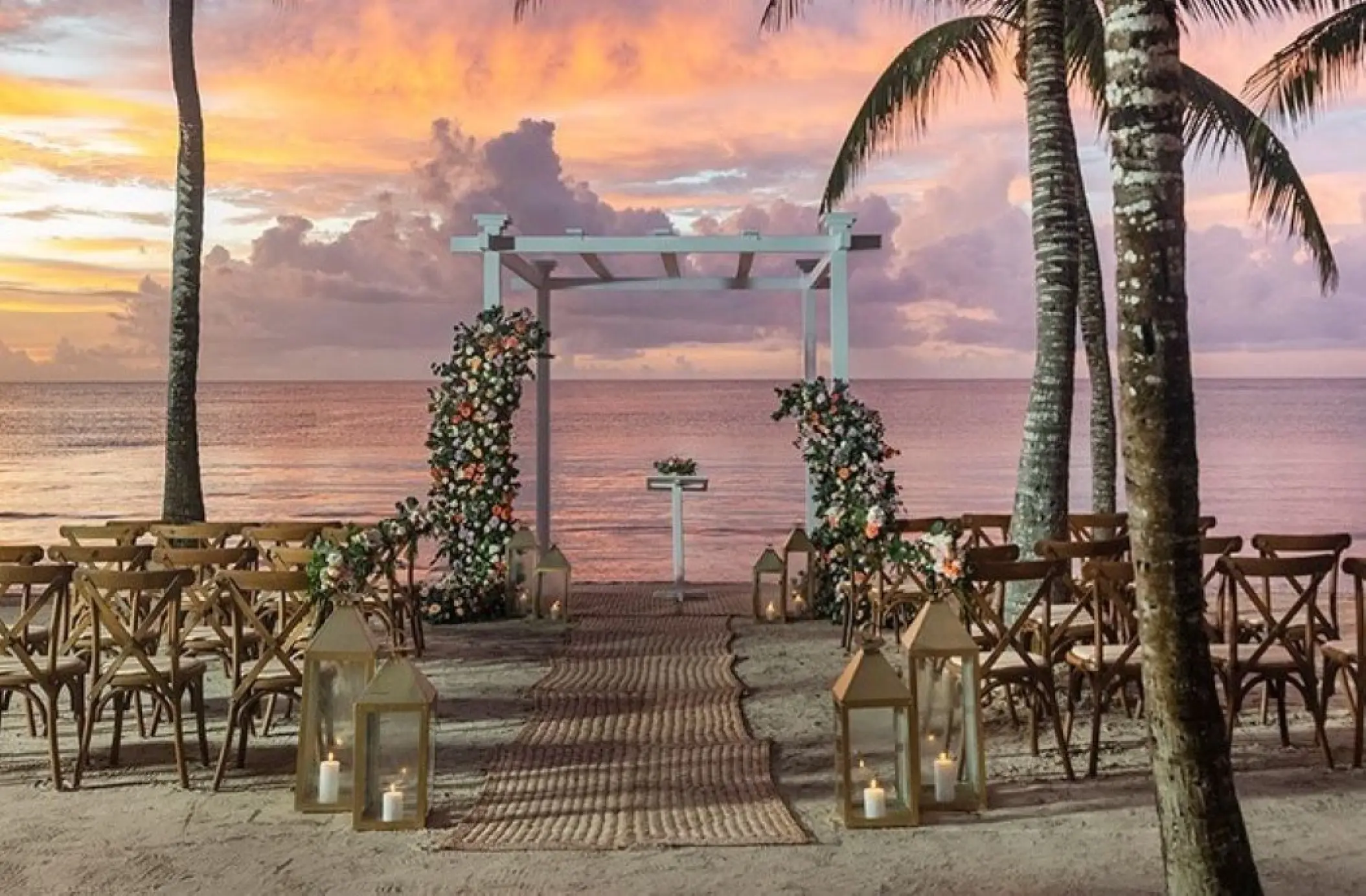 Beachfront wedding ceremony with Garden Blooms decor at TRS Turquesa, Punta Cana