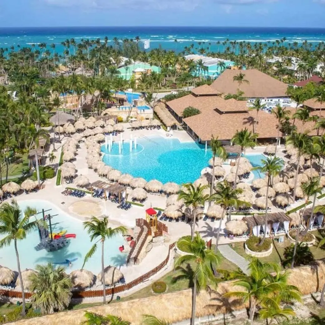 Aerial view of swimming pools and palm trees at Grand Palladium Punta Cana, Punta Cana