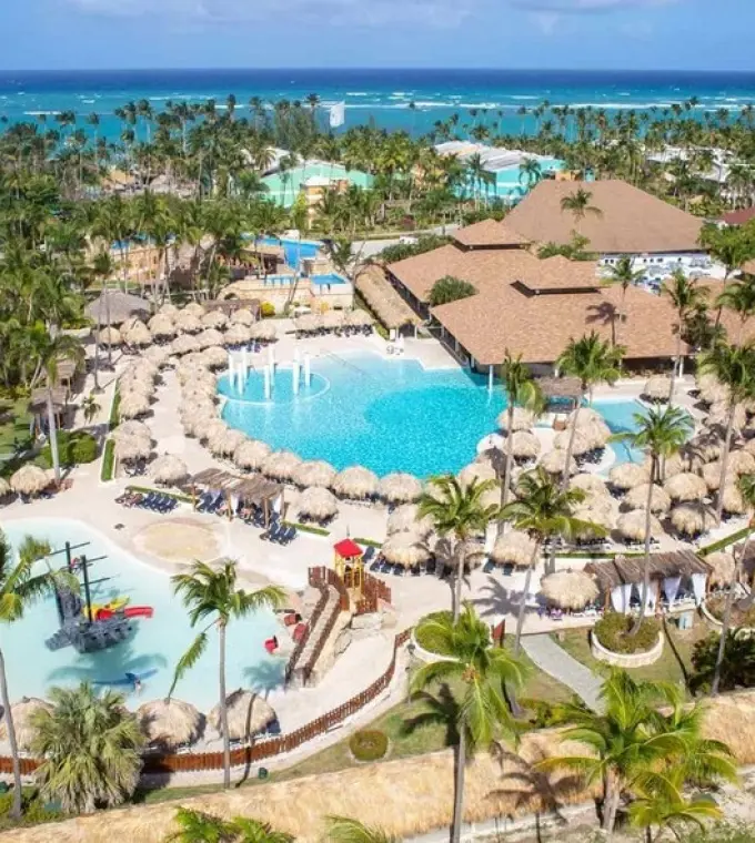 Aerial view of swimming pools and palm trees at Grand Palladium Punta Cana, Punta Cana