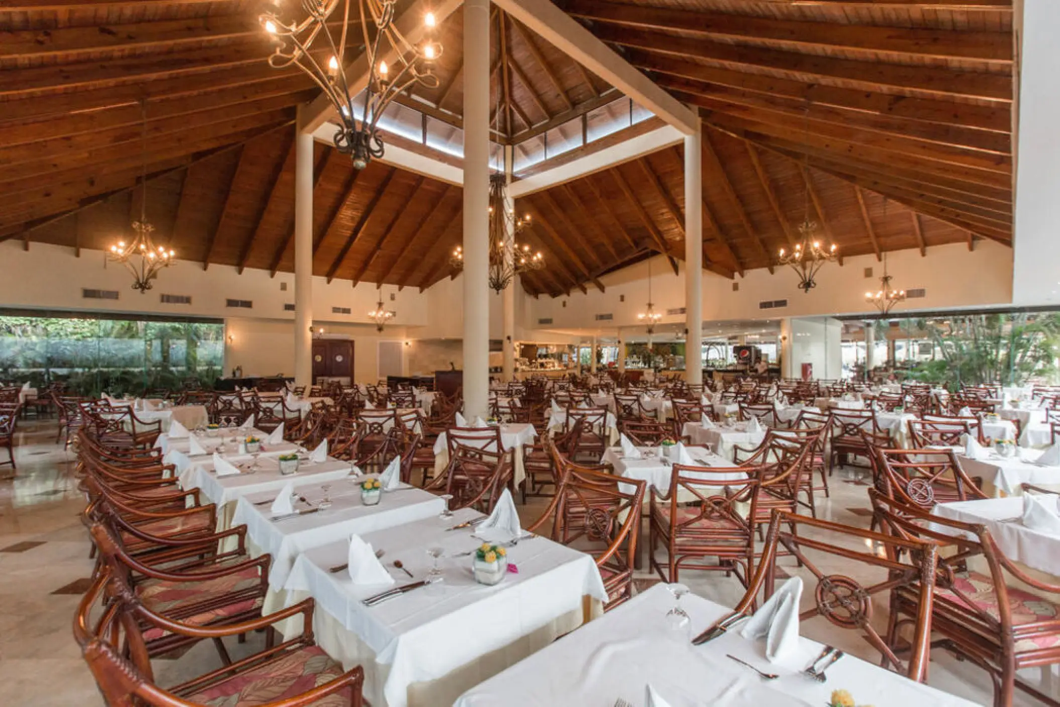 Poseidon restaurant with high vaulted wood ceilings at Grand Palladium Punta Cana